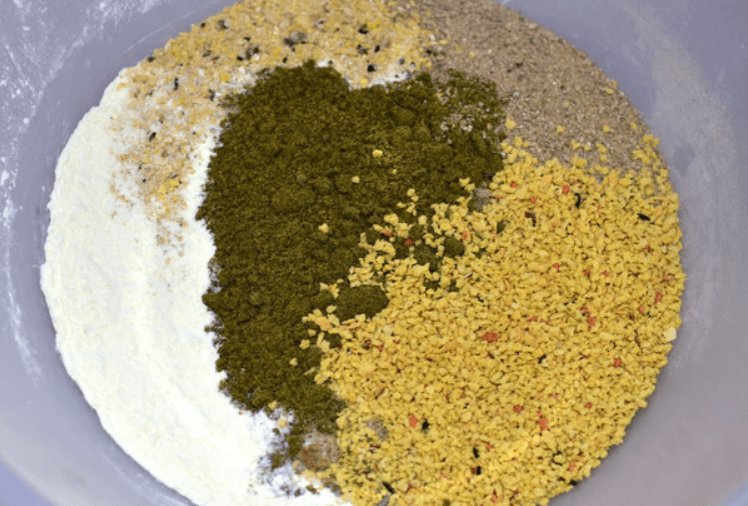 Mix of bird food fishing bait in a bowl.