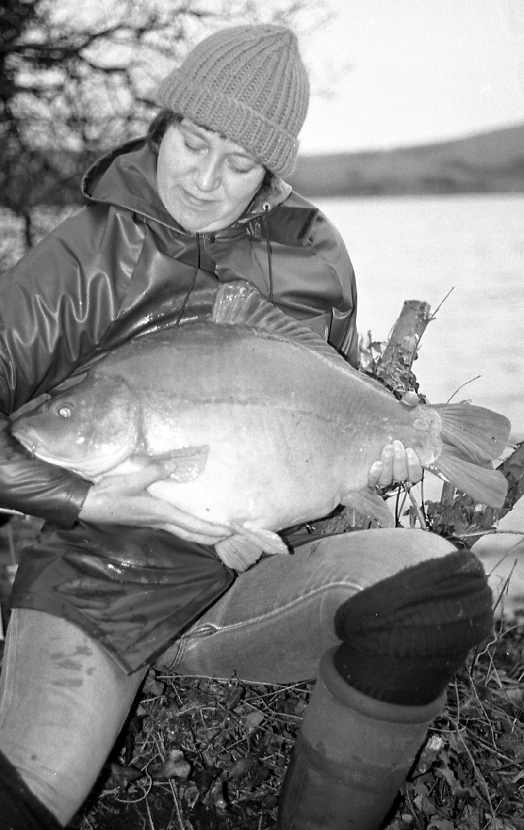 lady holding a large carp