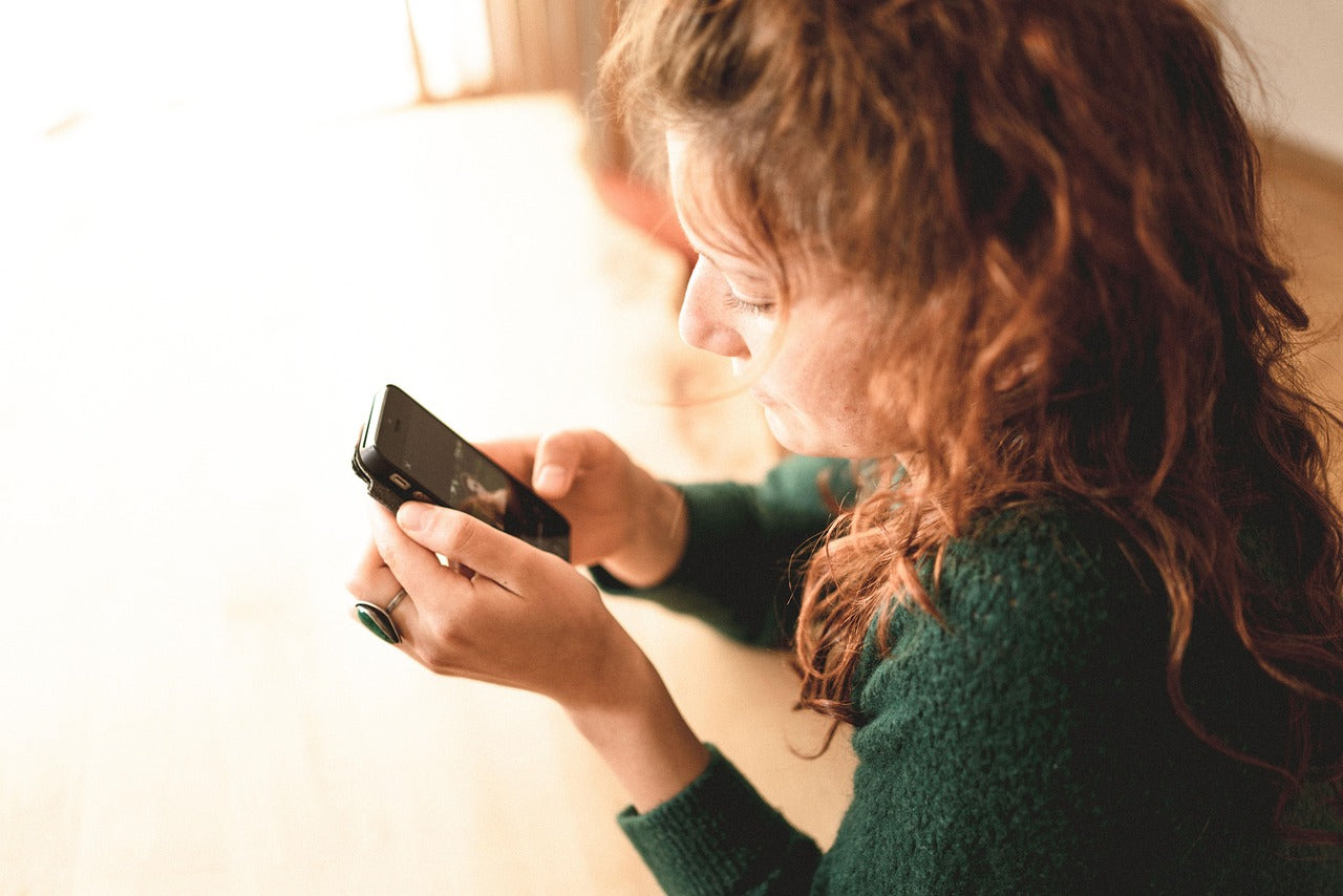 lady holding a mobile phone