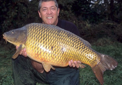 Image of Ken Townley holding a large carp