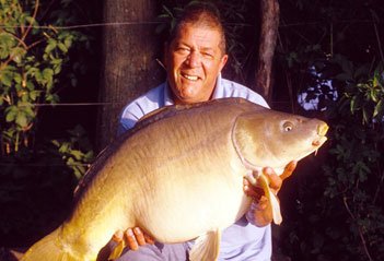 Ken Townley holding a large carp