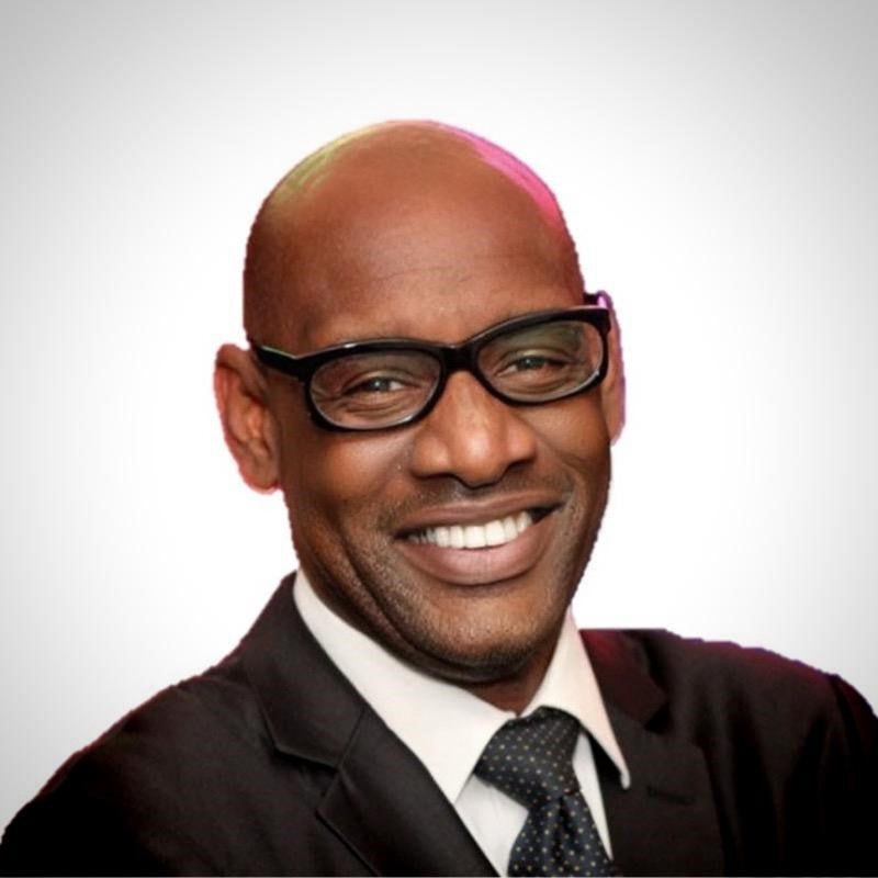 Shaun Wallace smiling for a headshot. 