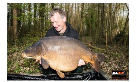 Angler holding a carp that he caught