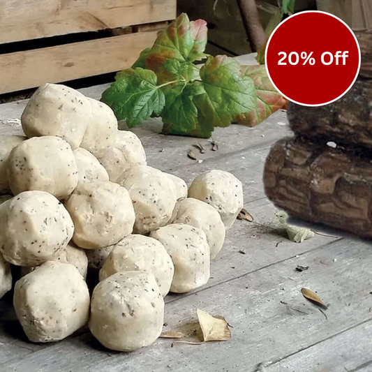 pile of suet balls on a wooden base with a logo