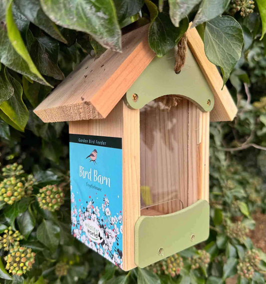 Sage green wooden bird seed feeder with pitched roof.