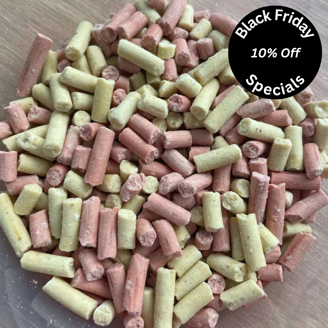 A mixture of pink and yellow/green suet pellets for birds. 