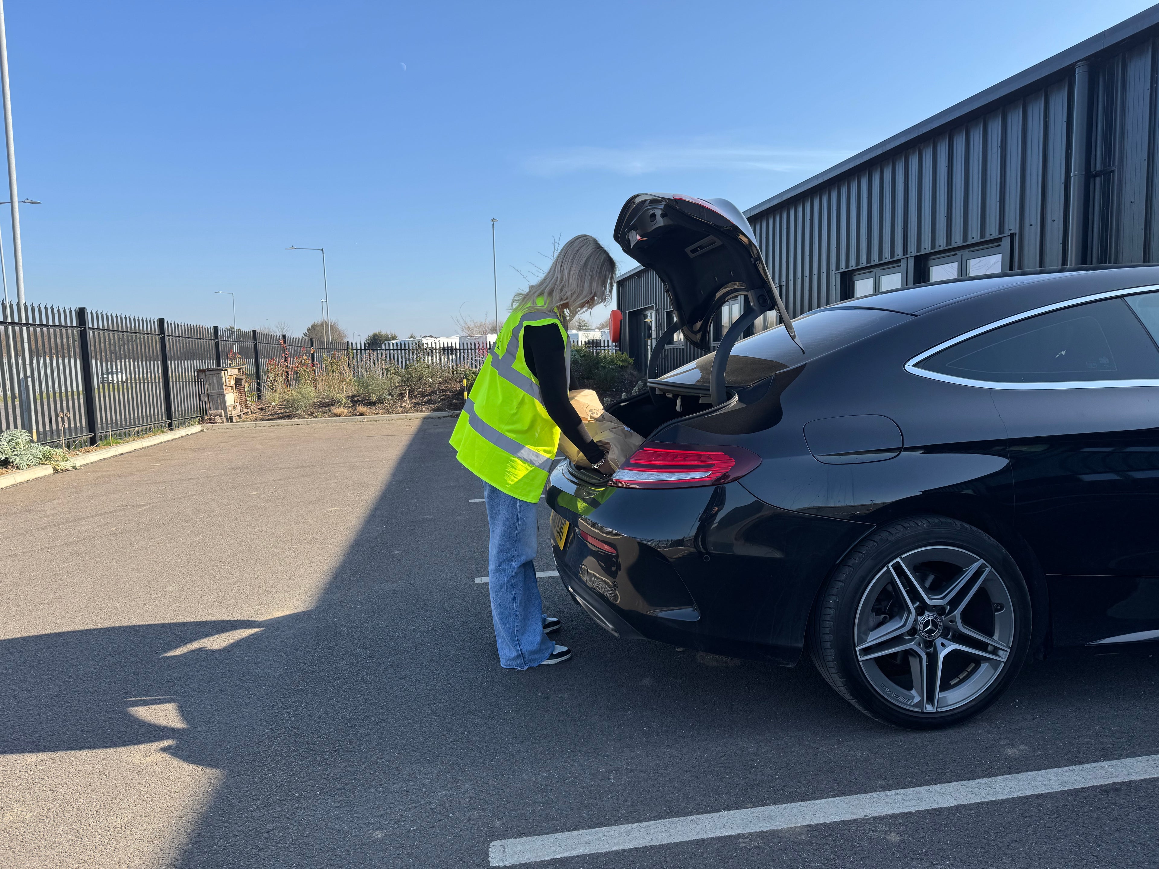 person uploading their car with products from Haith's shop