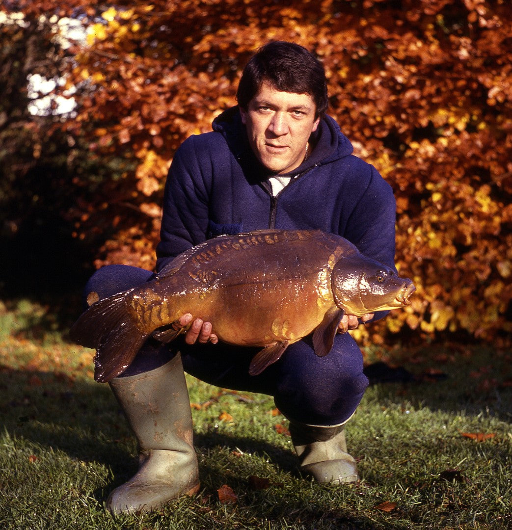 man holding a carp