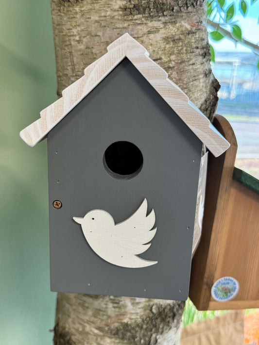 Hand-painted nest box with a white roof and dark grey body - white bird embellishment on the front.