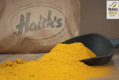 gold coloured powder in front of a brown paper bag