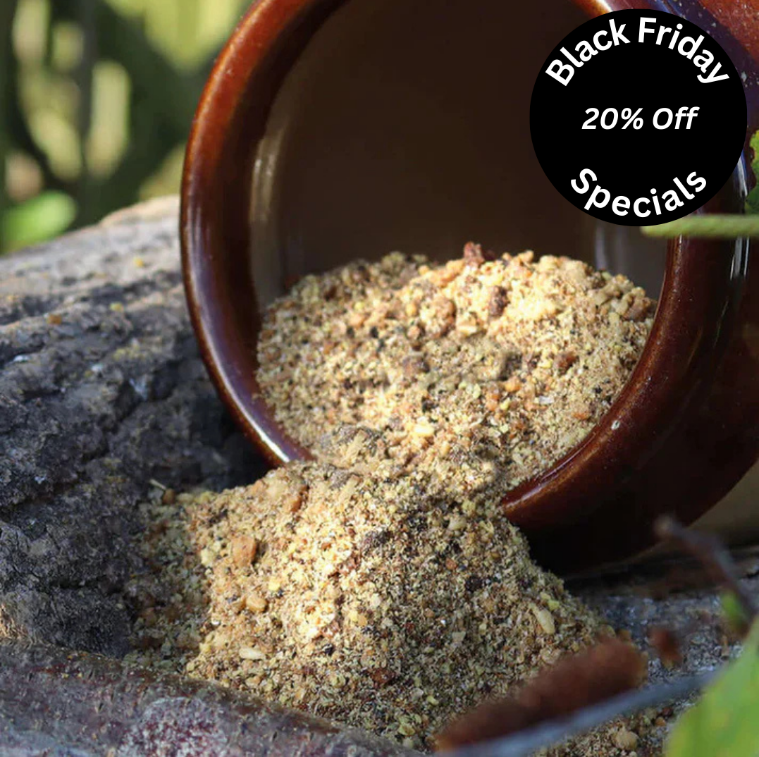 A crumbly softfood for birds in a ceramic pot. 