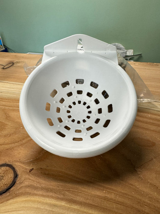 Photo of plastic canary nest bowl/pan with hanging loop at top and multi holes in bowl for drainage
