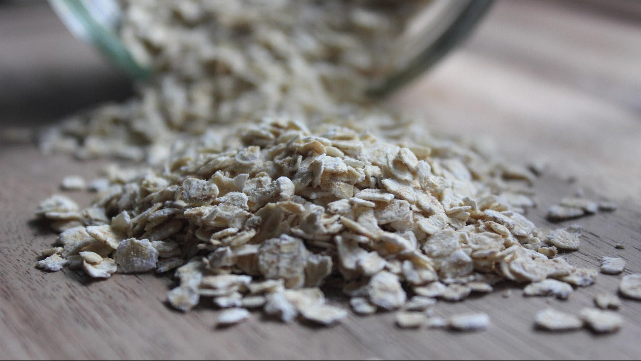 porridge oats spilling out of a glass jar