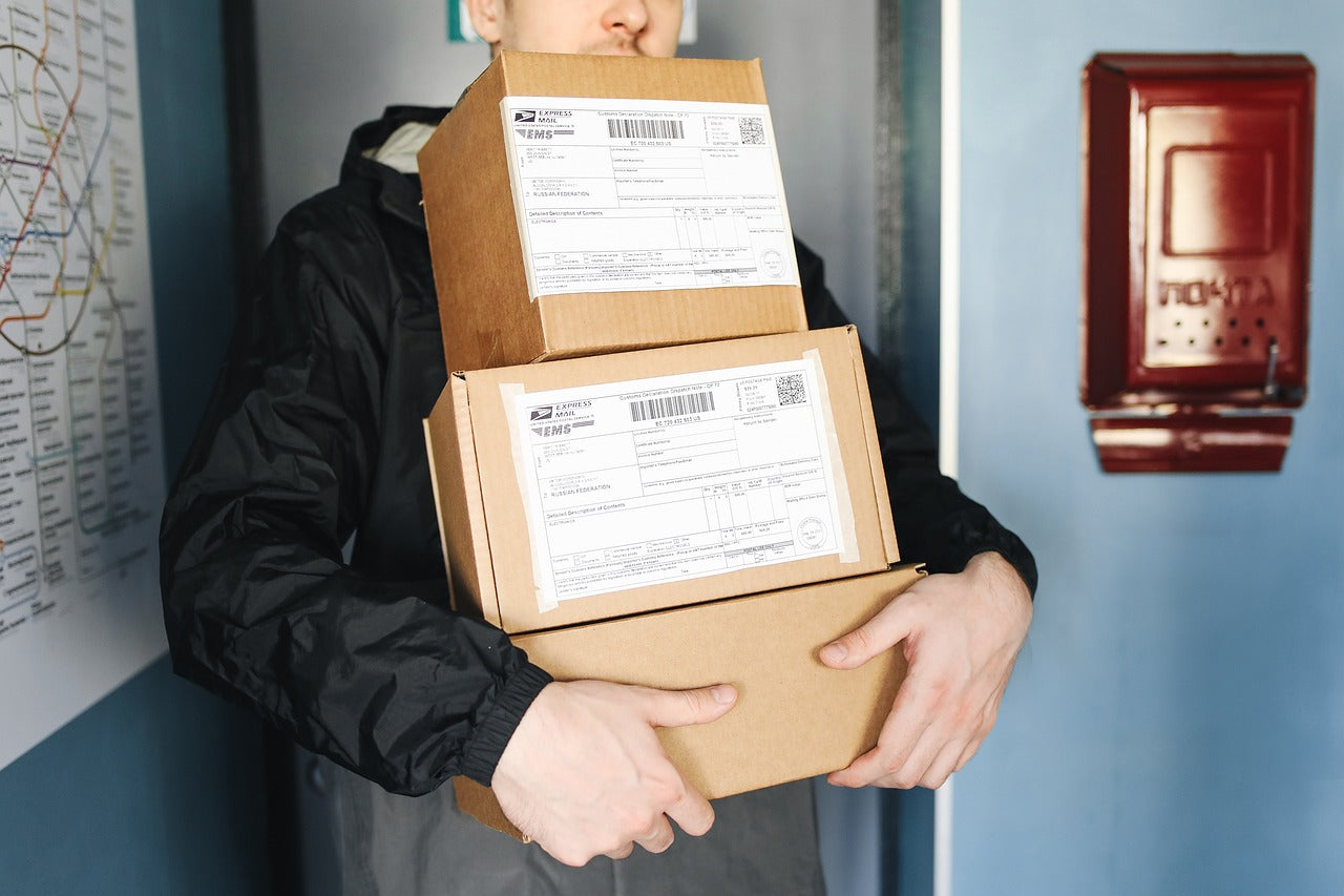 delivery driver holding packages