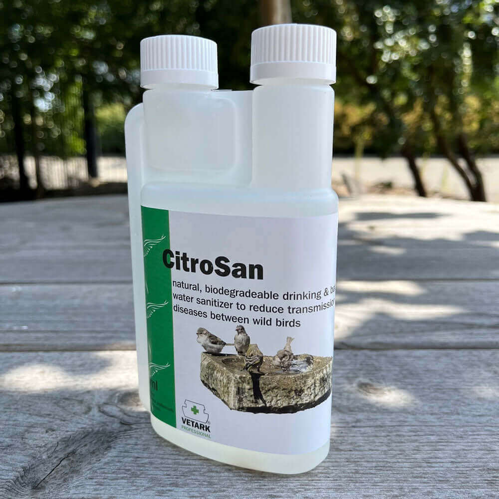 Large clear bottle of CitroSan for bird hygiene. 