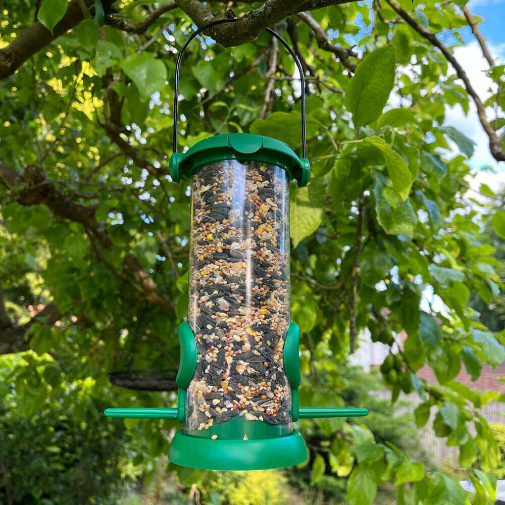 Fliptop green seed feeder with two feeding ports