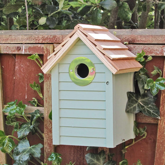 Gorgeous nest box with wooden slate roof, silver rimmed entrance hole and panelled front.