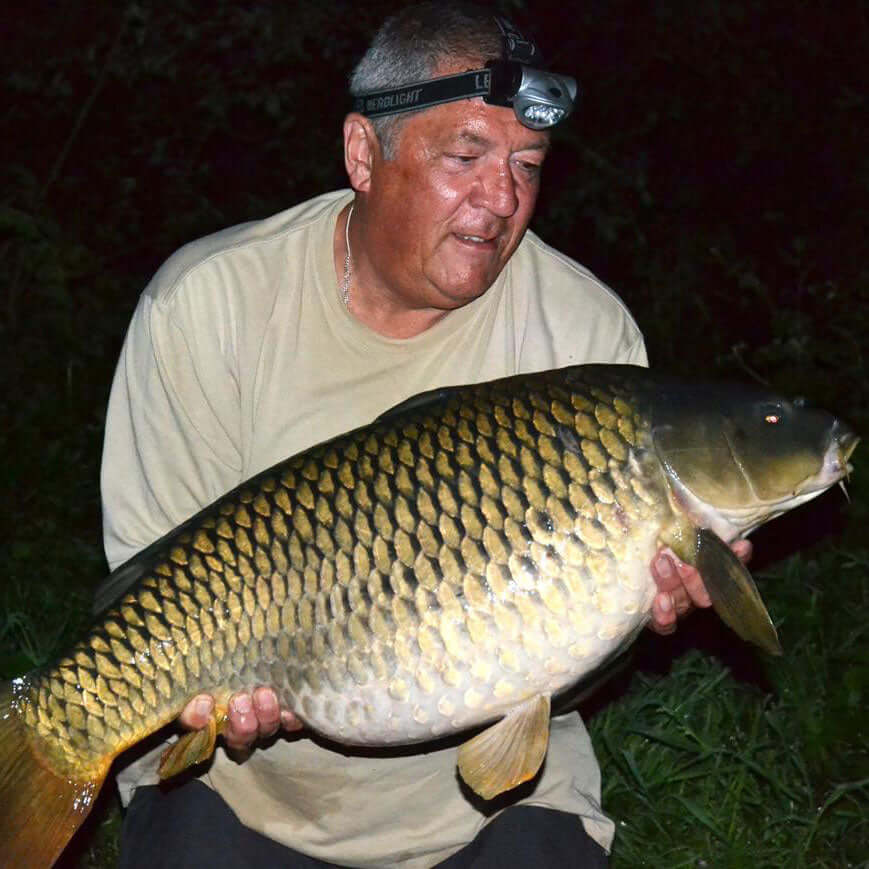 Ken Townley, fishing expert, with his catch using award winning Haith's fishing bait Red Band® Pigeon Conditioner. 