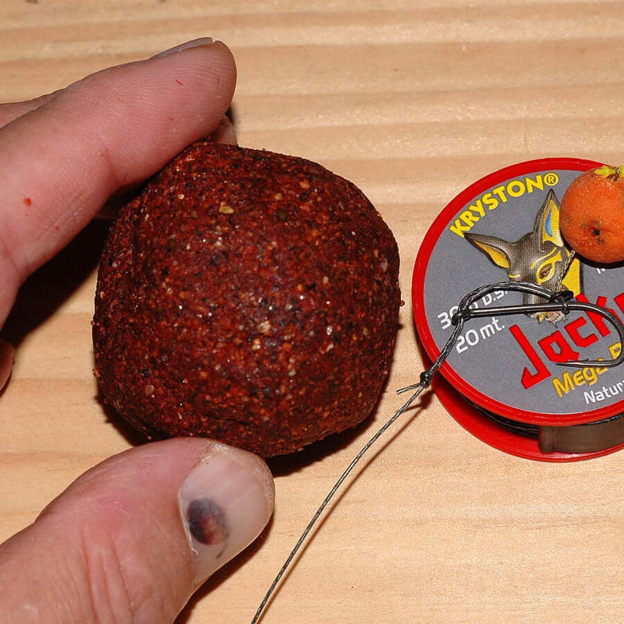 A circular boilie made using GTP Spice™ - this mix is a powerful, spicy fishing base ingredient mix. 
