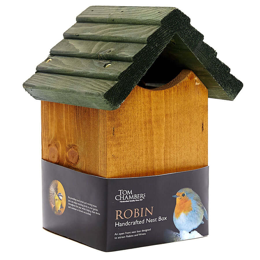 A handcrafted nest box with an opening between the base and green roof, for robins.