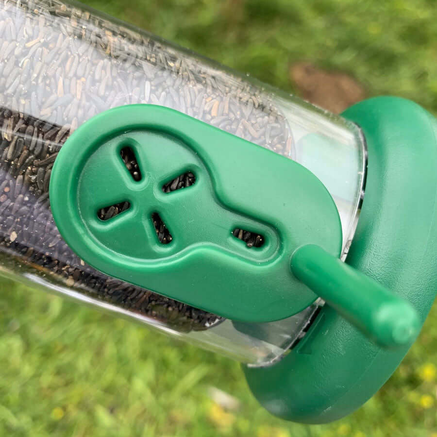 Small port openings made with green plastic for easy cleaning and refillling