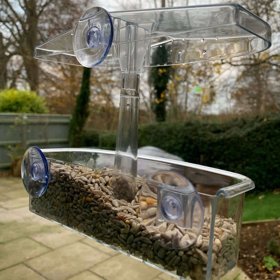 Three suction cups that secure this feeder to glass. 
