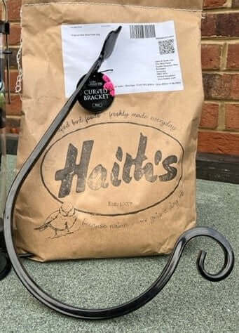 Sturdy, black curved bracket suitable for hanging a bird feeder, available from Haith's.